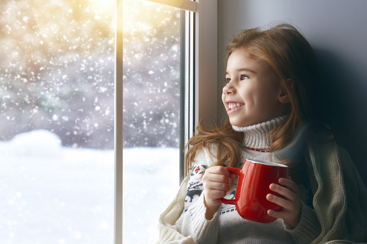 picture of young girl warm and cozy inside on a cold winter day